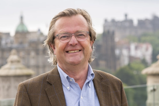 A head and shoulders photograph of John Waddell 